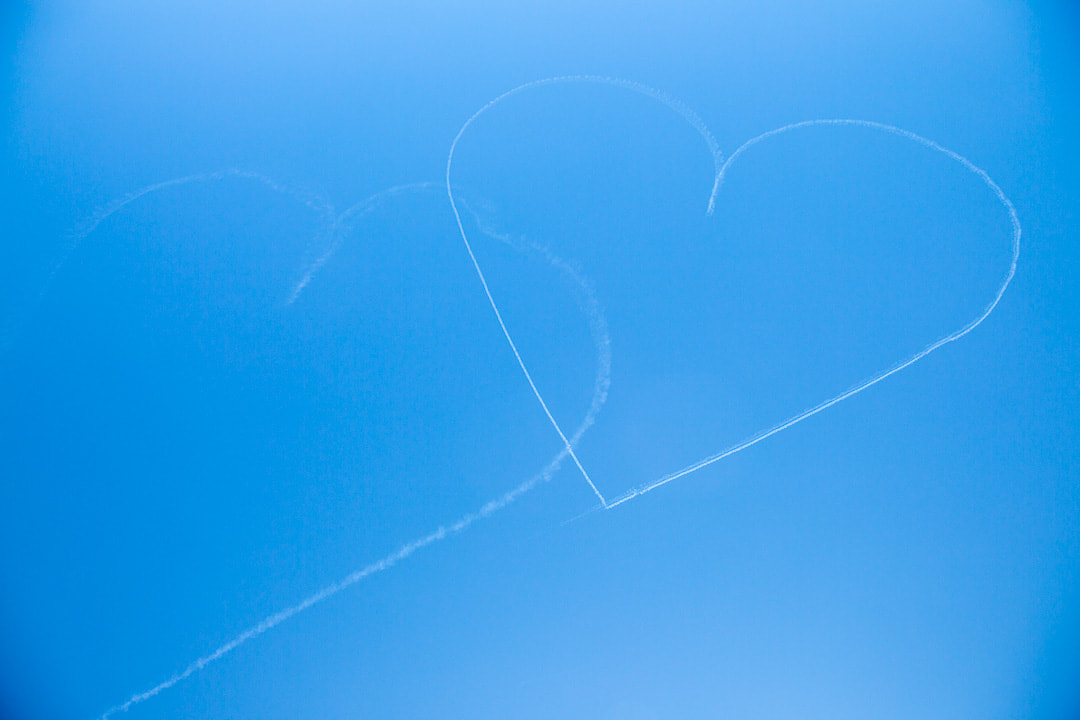 Hearts drawn in the sky over Sioux Falls by aerial stunt team Vanguard Squadron